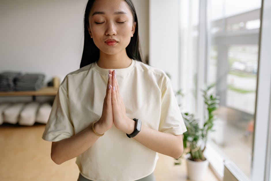 A calm person meditating in a quiet, minimalist room.