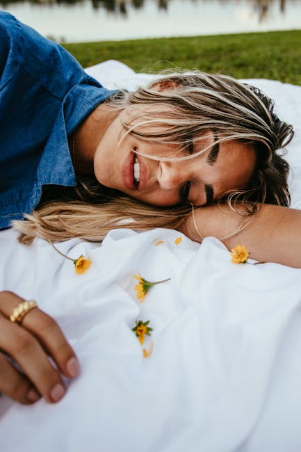 Serene woman in a calm, relaxed state, lying on a soft blanket.